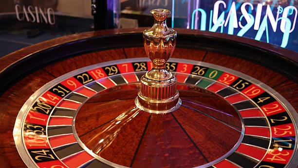 Live dealer Caribbean Stud Poker table on winlive4 with cards and betting interface