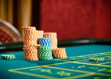 Mega Moolah game interface on mobile phone showing stake selector and spin button